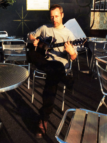 Hugh Featherstone at a cafe in Berlin